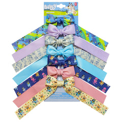 LUV HER smiling child wearing bow in casual setting conveying joyful wear