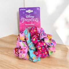 LUV HER scrunchies styled on a bedside table in a bedroom scene showing lifestyle use
