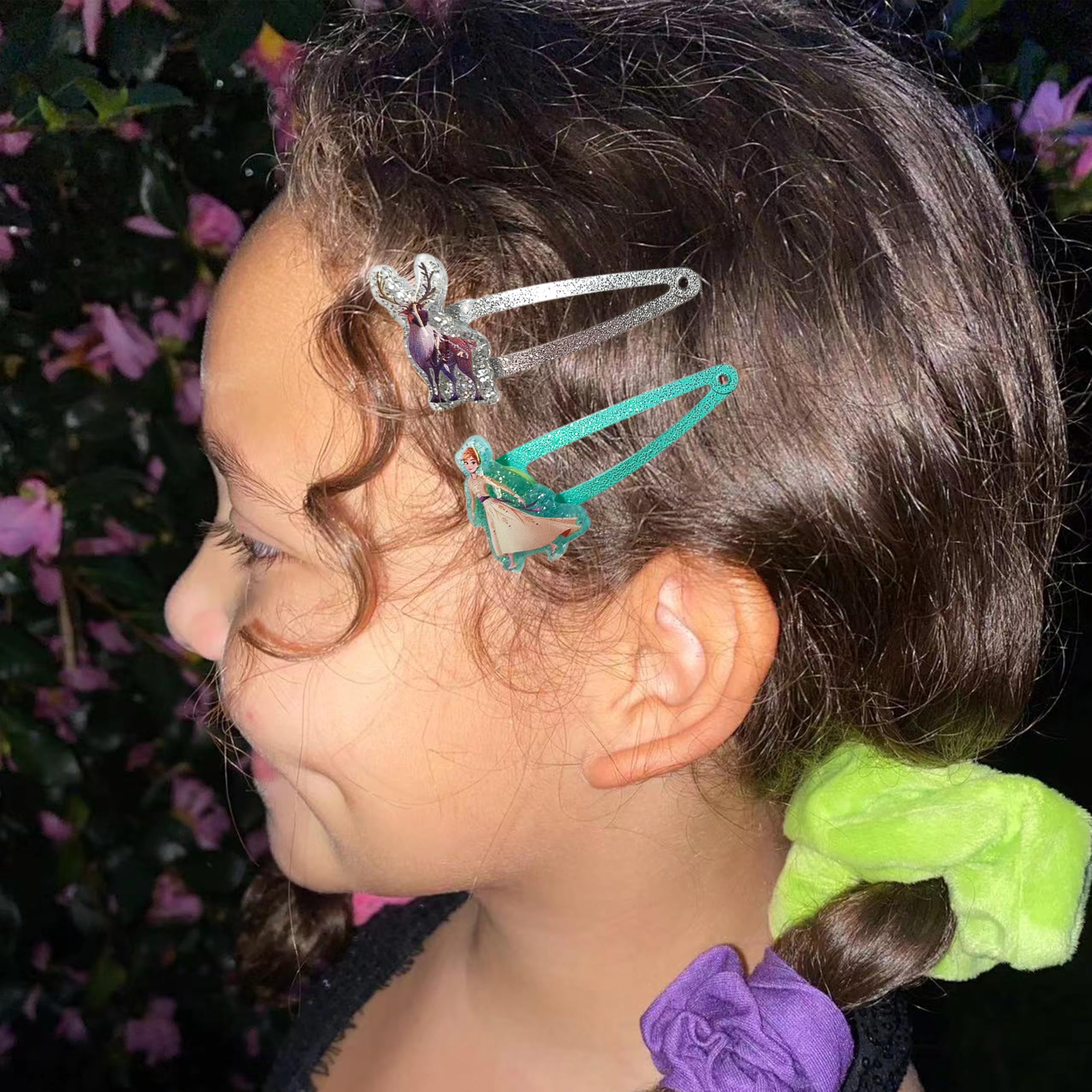LUV HER clips held in adult hand showing true size and lightweight benefit