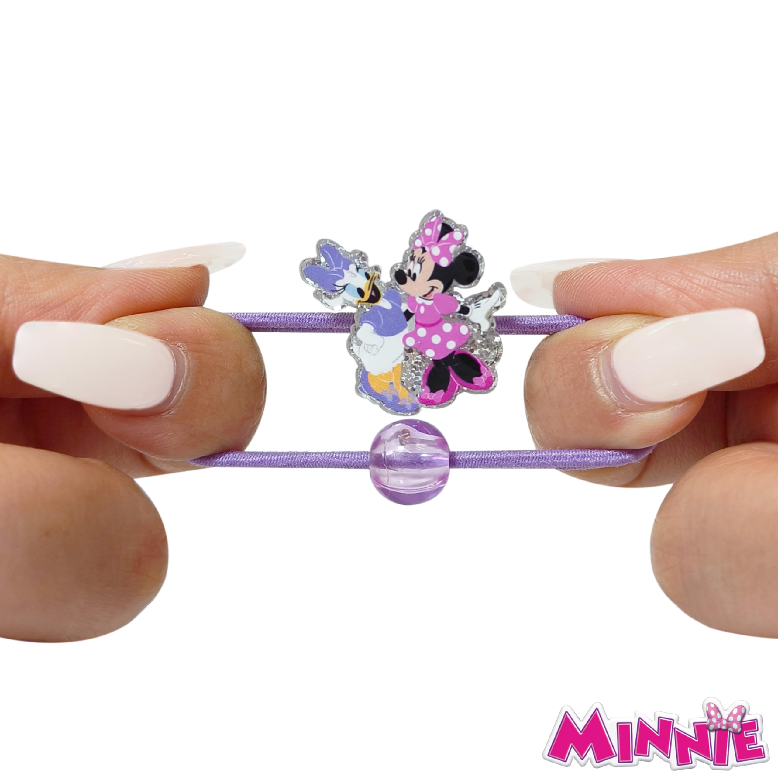 LUV HER hair ties on a wrist for size comparison, easy portability shown