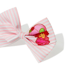 LUV HER clip beside a ruler showing the 4-inch bow size for styling scale