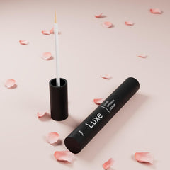 LUXE eyelash serum texture drop closeup showing lightweight formula for easy absorption