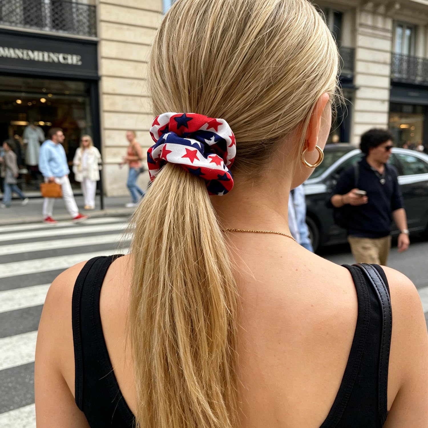 LYLYNB scrunchie held in hand for scale, shows compact travel-friendly size