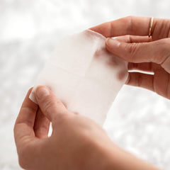 m-61 pad being applied to cheek showing simple at-home exfoliation