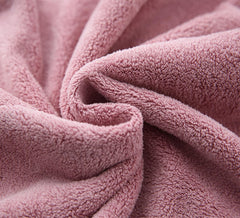 M-bestl model wearing towel wrap in bathroom demonstrating comfortable stay-put drying