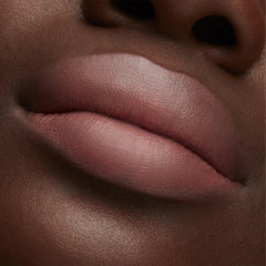 MAC Lustre Hug Me packaging label close view showing shade name and brand