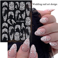 Macute floral decals applied on natural nails creating a bridal elegant finish