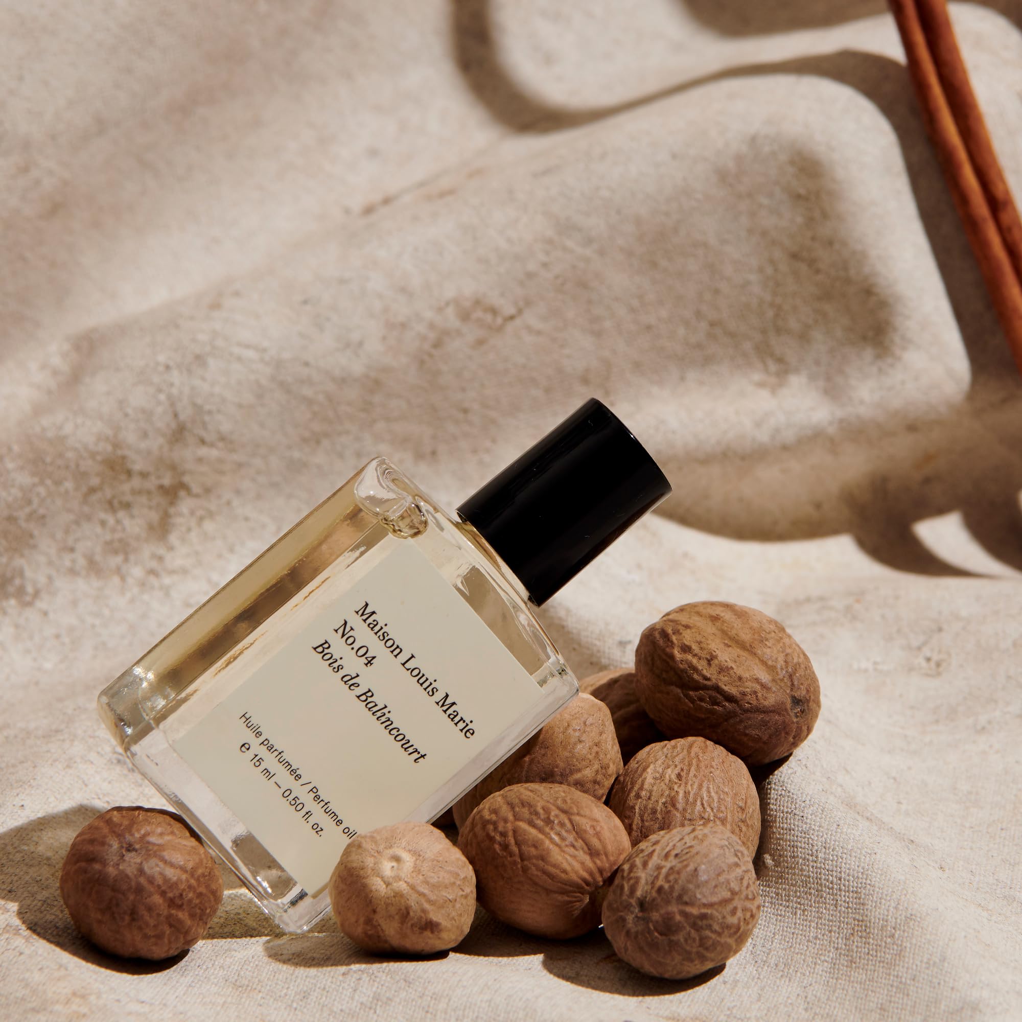 Maison Louis Marie oil dabbed on skin showing texture and long-lasting benefit