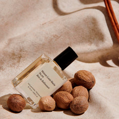 Maison Louis Marie oil dabbed on skin showing texture and long-lasting benefit
