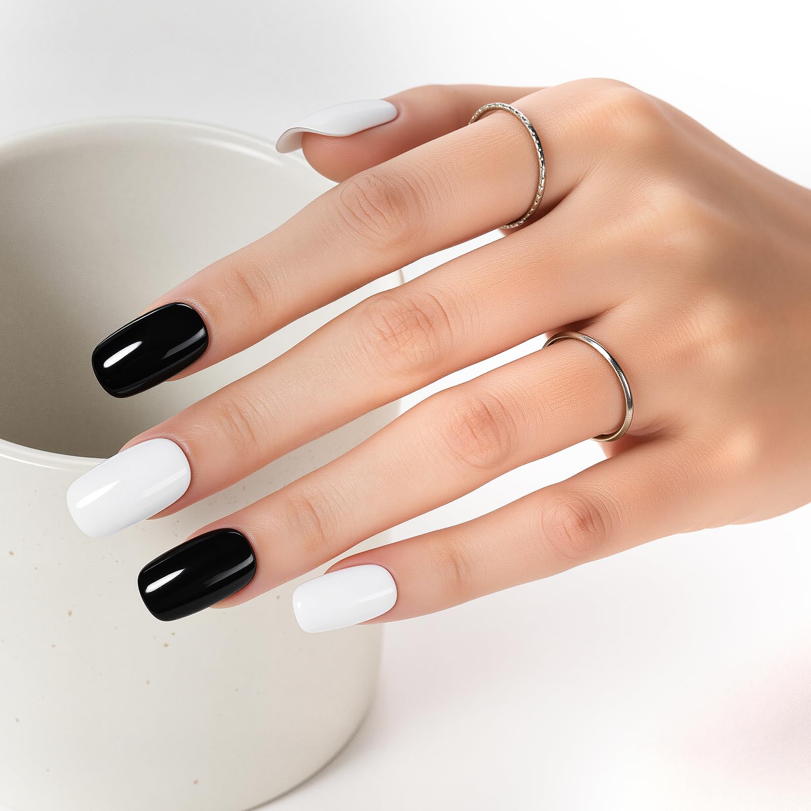 Makartt bottles held in hand to show scale and travel-friendly compact size