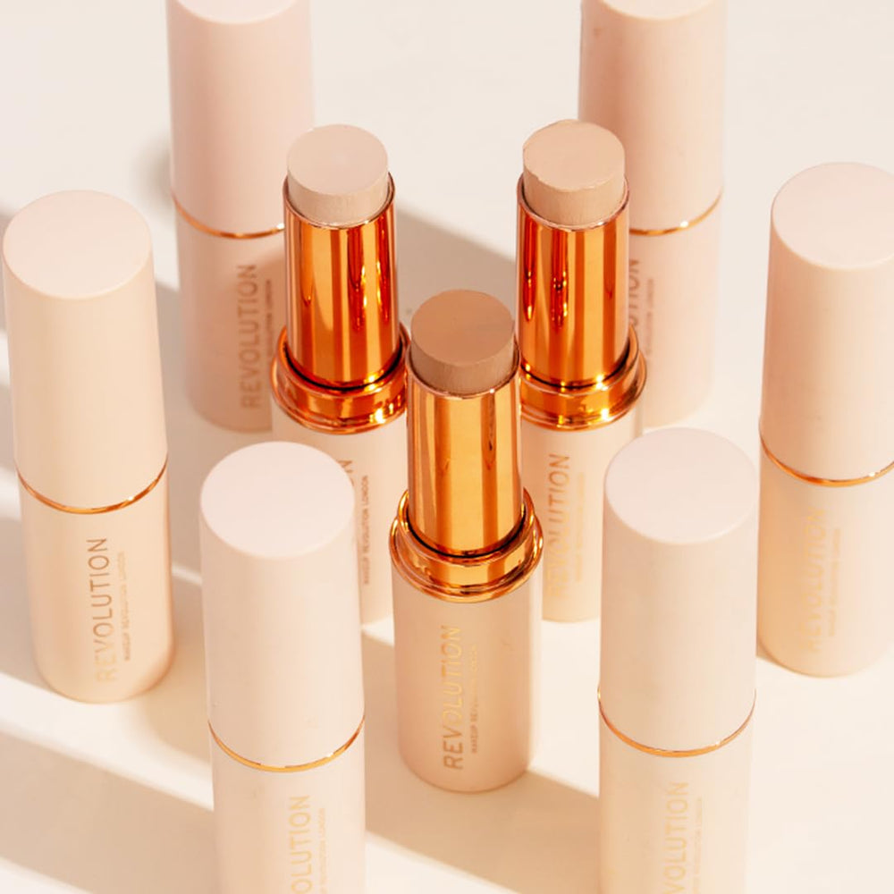 Makeup Revolution stick beside coin showing compact size and travel convenience benefit