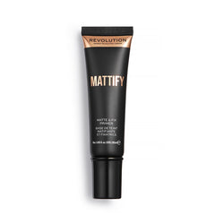Makeup Revolution primer size comparison next to foundation bottle for travel-friendly boost