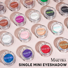 MAKI YIKA eyeshadow next to coin illustrating compact travel‑friendly size