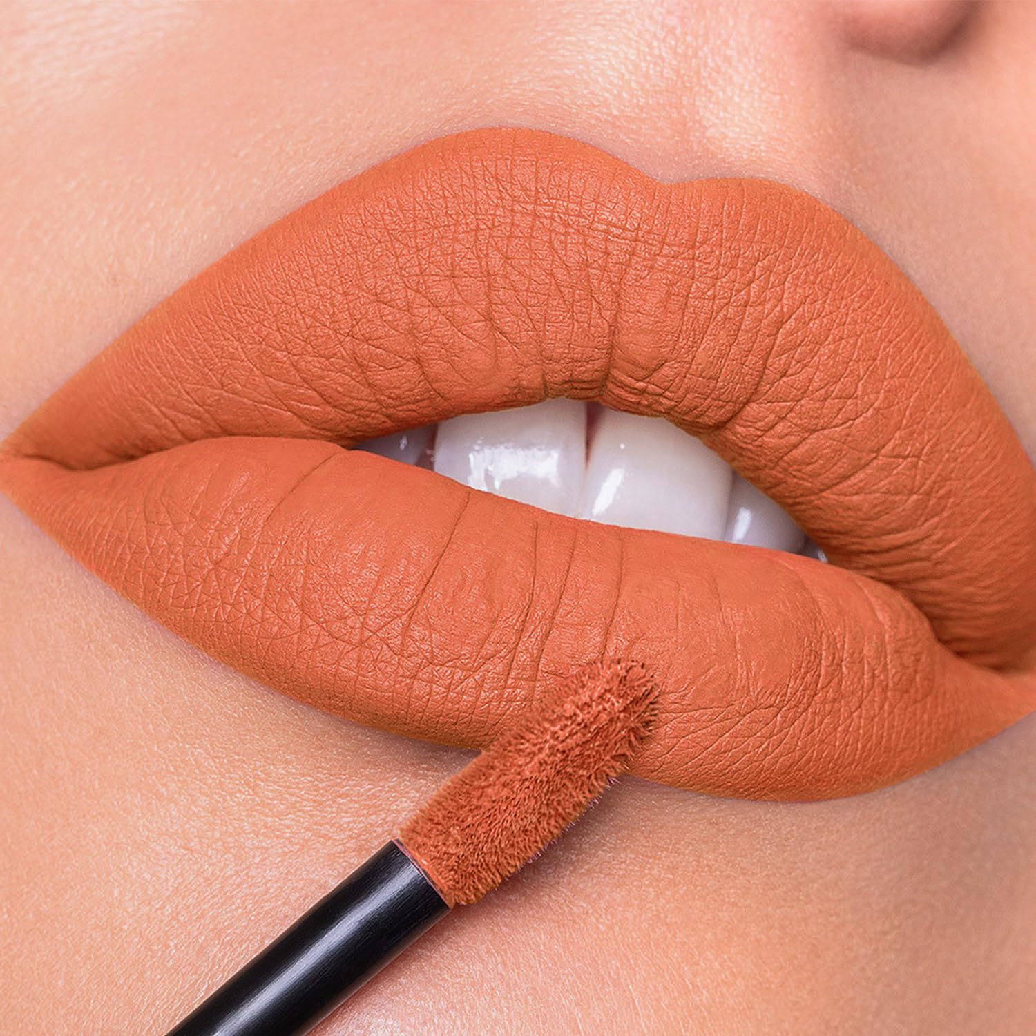 MAKI YIKA lip on model close-up demonstrating bold, transferproof color