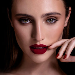 MAKI YIKA lip swatch on skin showing true dark red pigment payoff