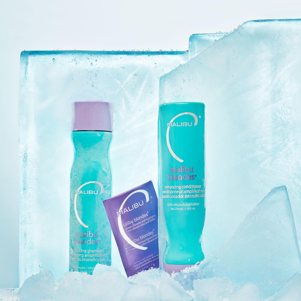 Malibu C shampoo being applied in shower to neutralize brassiness quickly