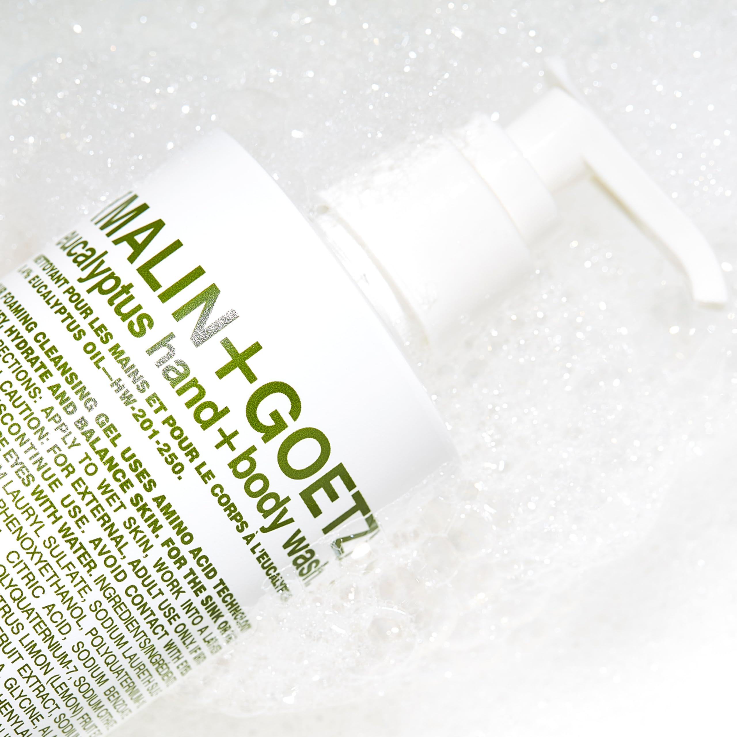 MALIN+GOETZ bottle set on shower shelf demonstrating routine use