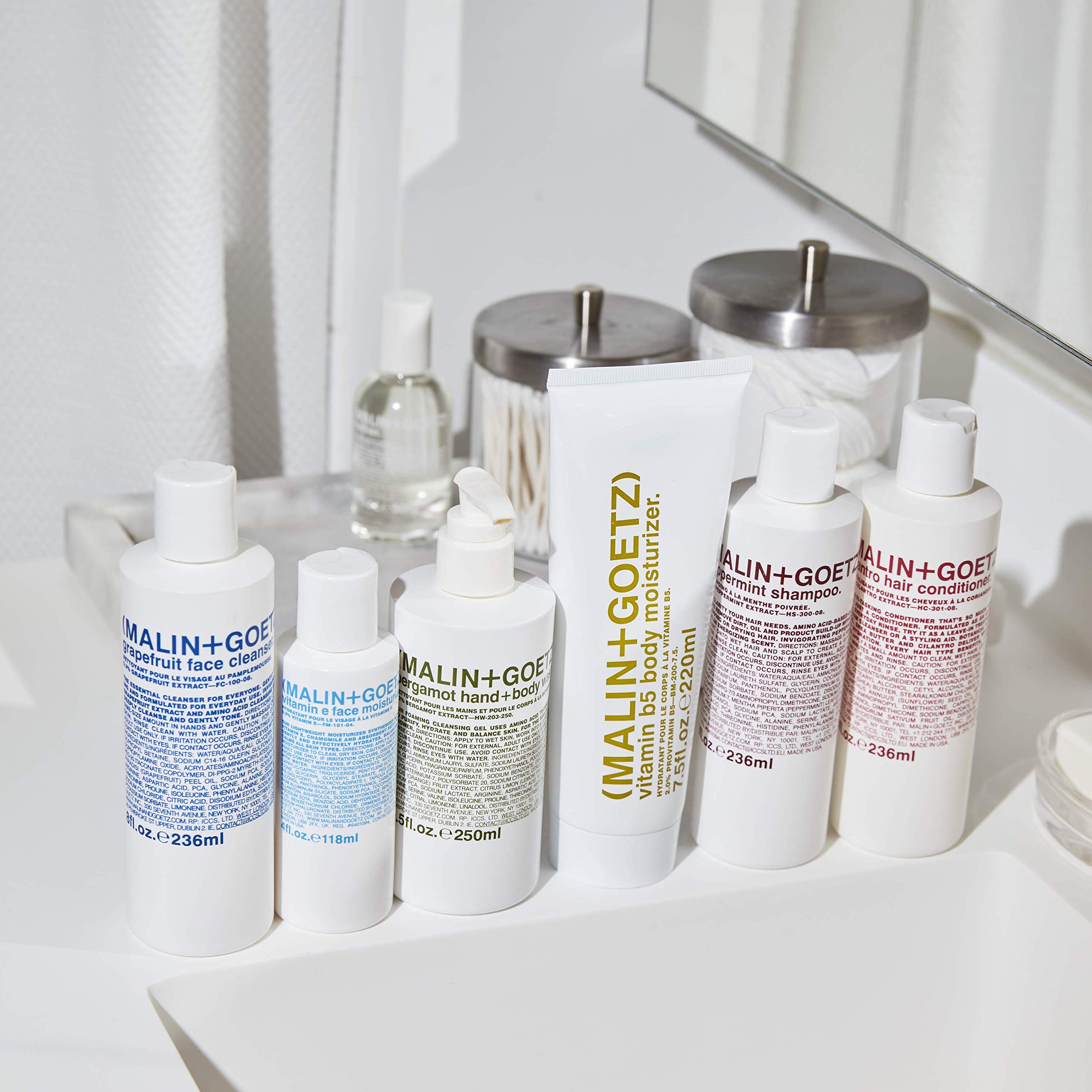 MALIN+GOETZ bottle staged in bathroom setting suggesting daily routine