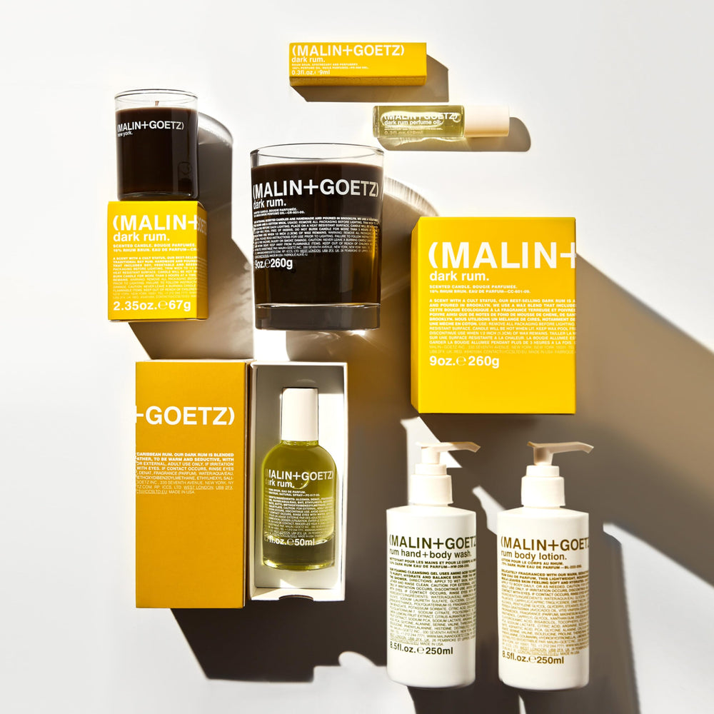 MALIN+GOETZ lifestyle image with outfit and grooming items illustrating subtle scent pairing