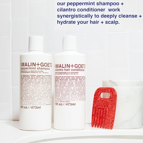 MALIN+GOETZ shampoo in bathroom lifestyle scene styled for modern, minimalist travel