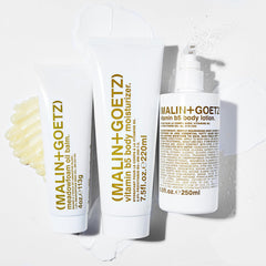 MALIN+GOETZ bottle on bathroom shelf highlighting clean packaging for daily routines