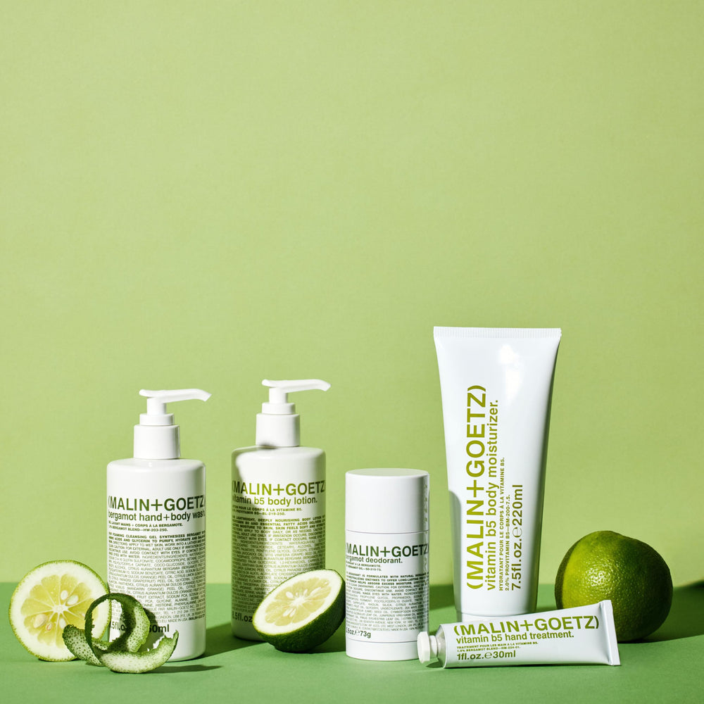 MALIN+GOETZ applied to forearm in lifestyle shot showing hydrated, softened skin
