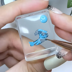 Maniology stamper picking up design from a metal stamping plate for clean transfers