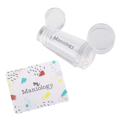 Maniology stamper in use aligning design on nail demonstrating accurate placement benefit