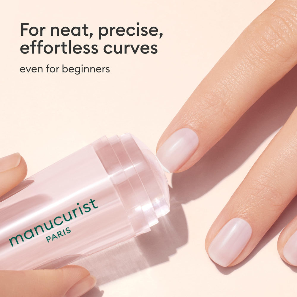 Manucurist Mani Stamper in use pressing a clean French tip quickly