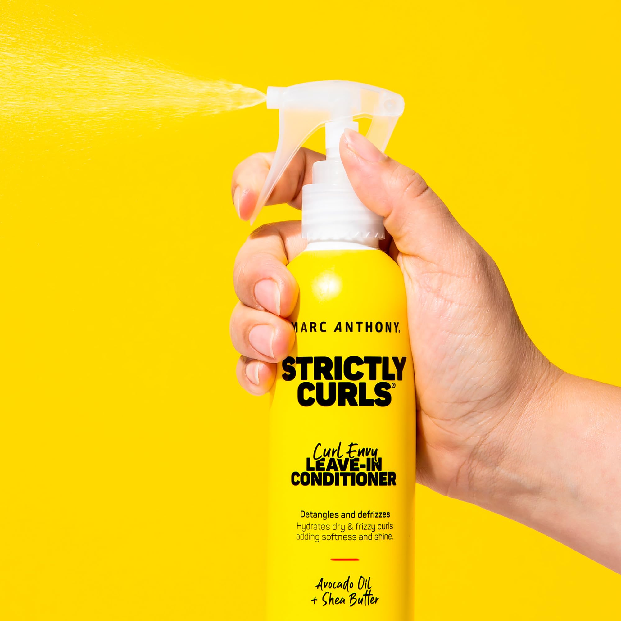 Marc Anthony 8.4 fl oz bottle beside a hand to show true size