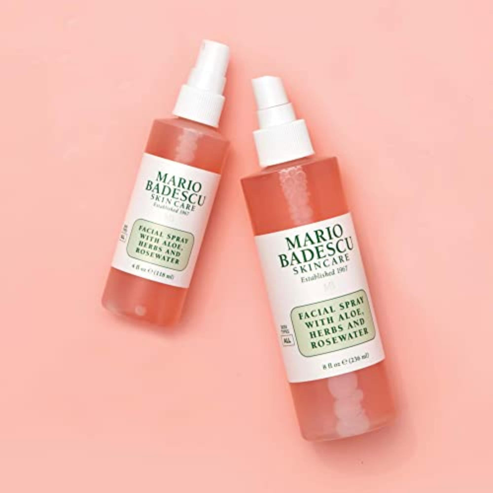 Mario Badescu bottle staged with rose and gardenia conveying botanical scent and calm benefit