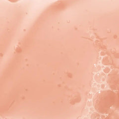 Mario Badescu bottle with rose petals and ingredients suggesting hydration