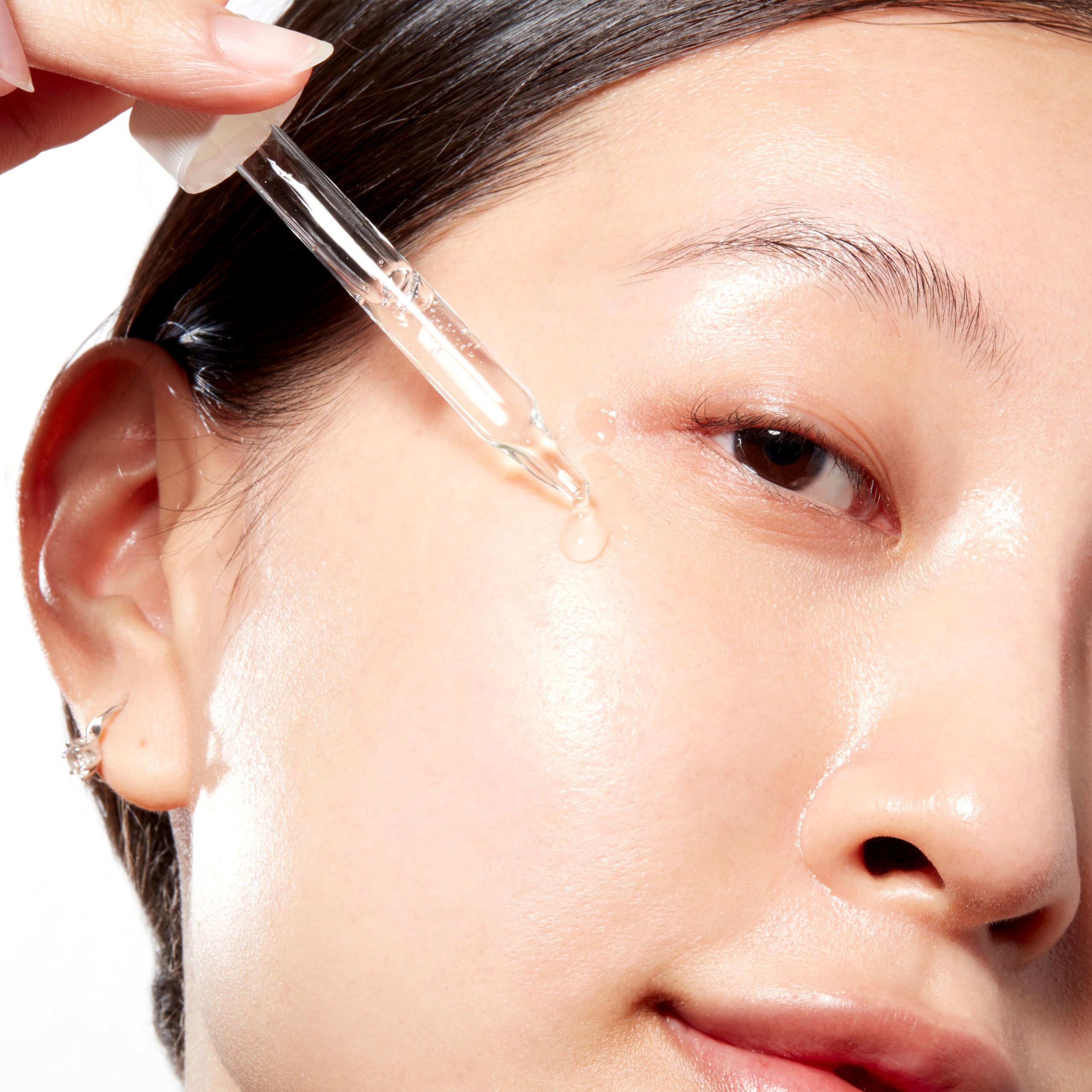 Applying Mario Badescu serum to back of hand, demonstrating quick absorption