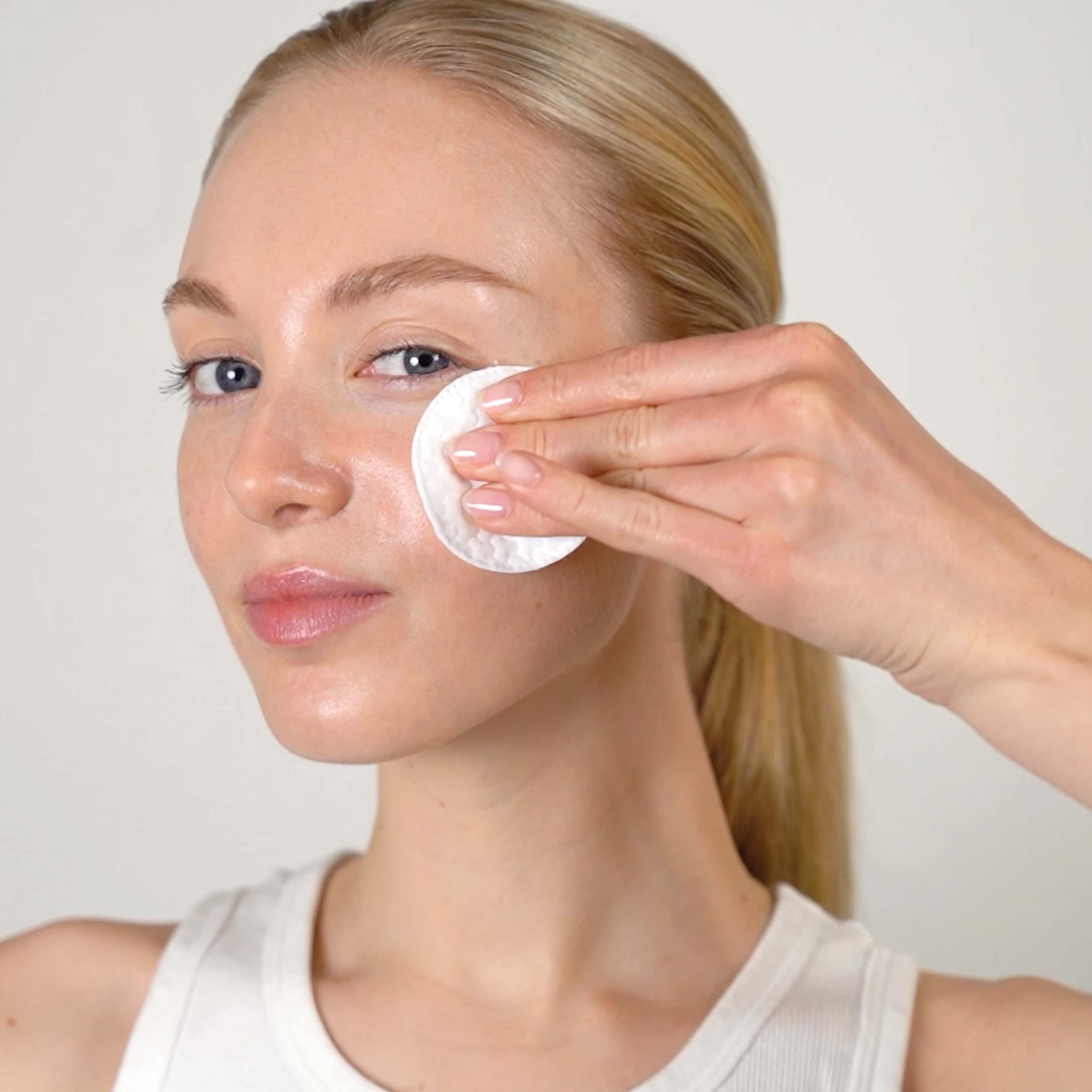 Mario Badescu toner pouring onto pad highlights lightweight texture benefit