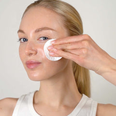 Mario Badescu toner pouring onto pad highlights lightweight texture benefit