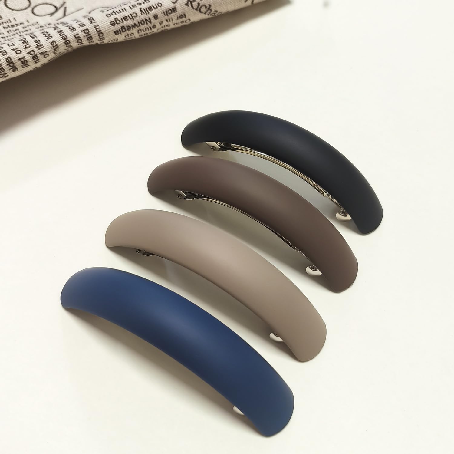 Markuii barrette securing a half-up style for all-day hold