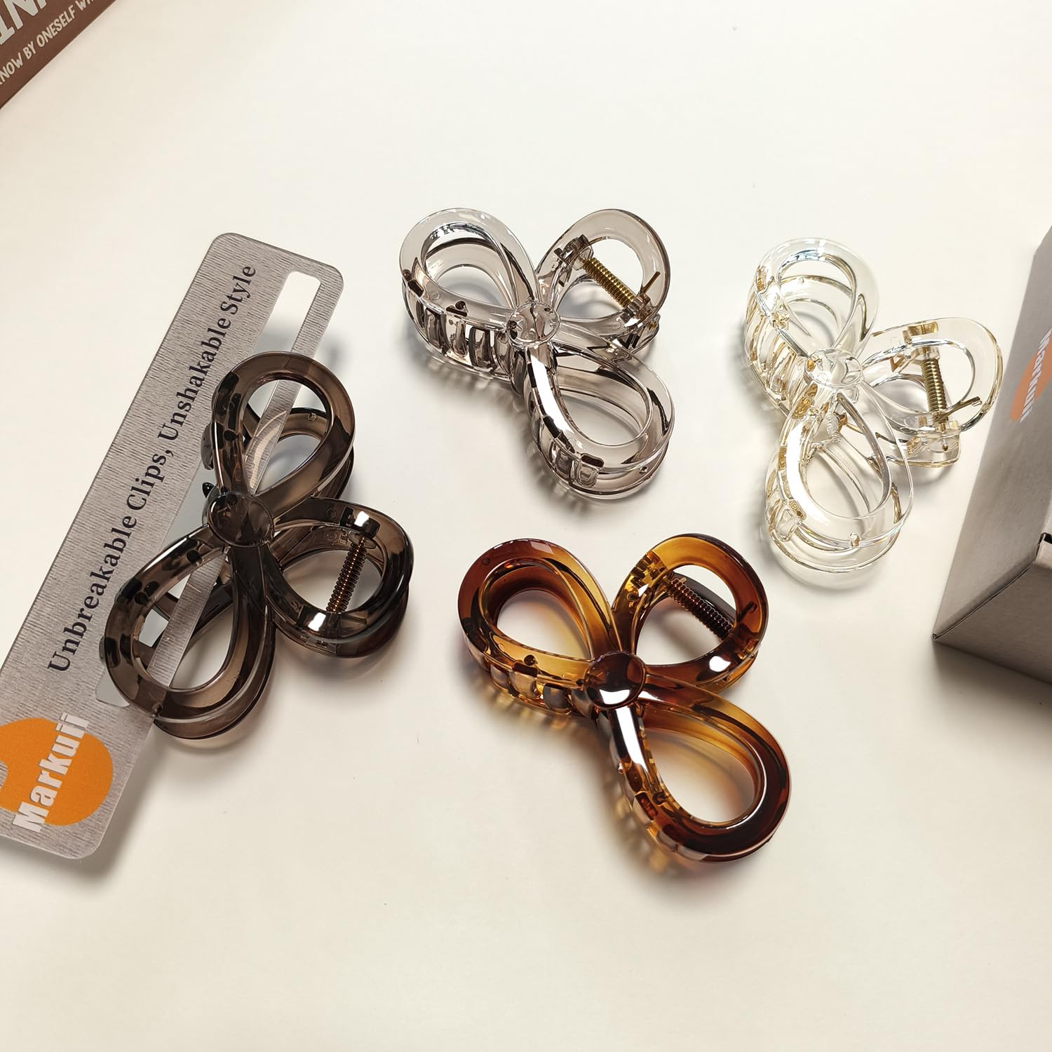 Markuii held in hand for scale, shows compact travel-friendly size