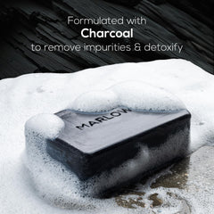 MARLOWE. close-up texture of charcoal soap showing exfoliant surface