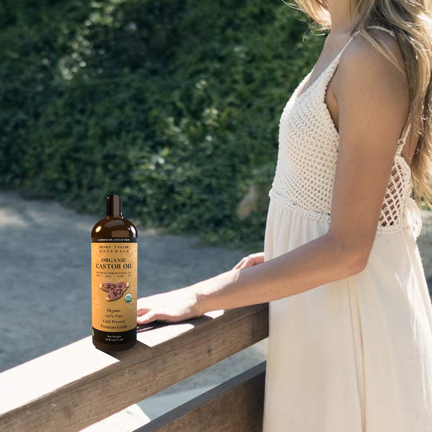 Mary Tylor Naturals oil pouring to show thick cold-pressed texture and nutrient preservation