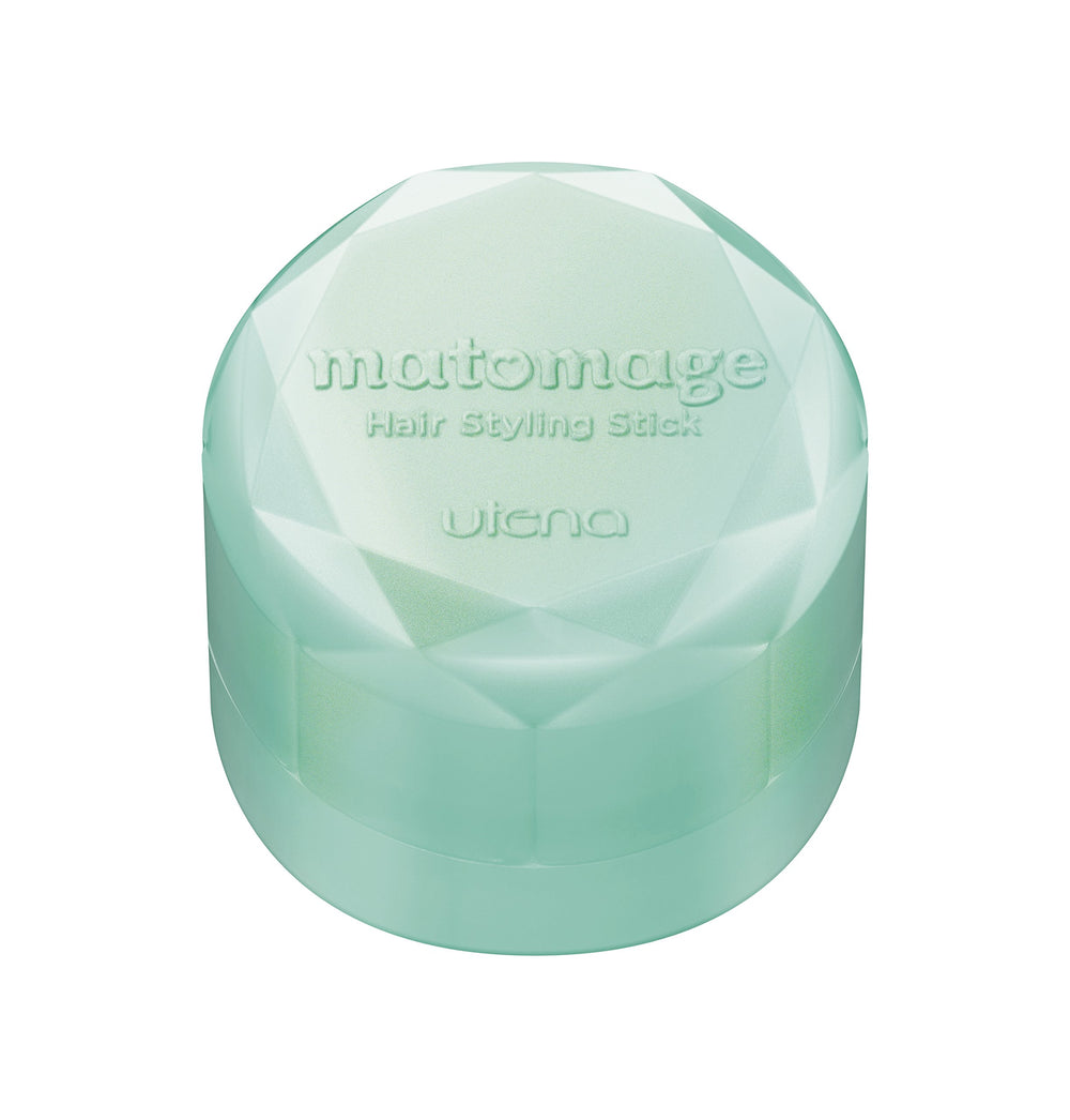 Matomege UTENA beside a hand to show 13 g size and travel-ready benefit