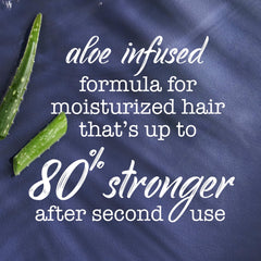 Applying Maui Moisture conditioner in shower for soft, touchable curls