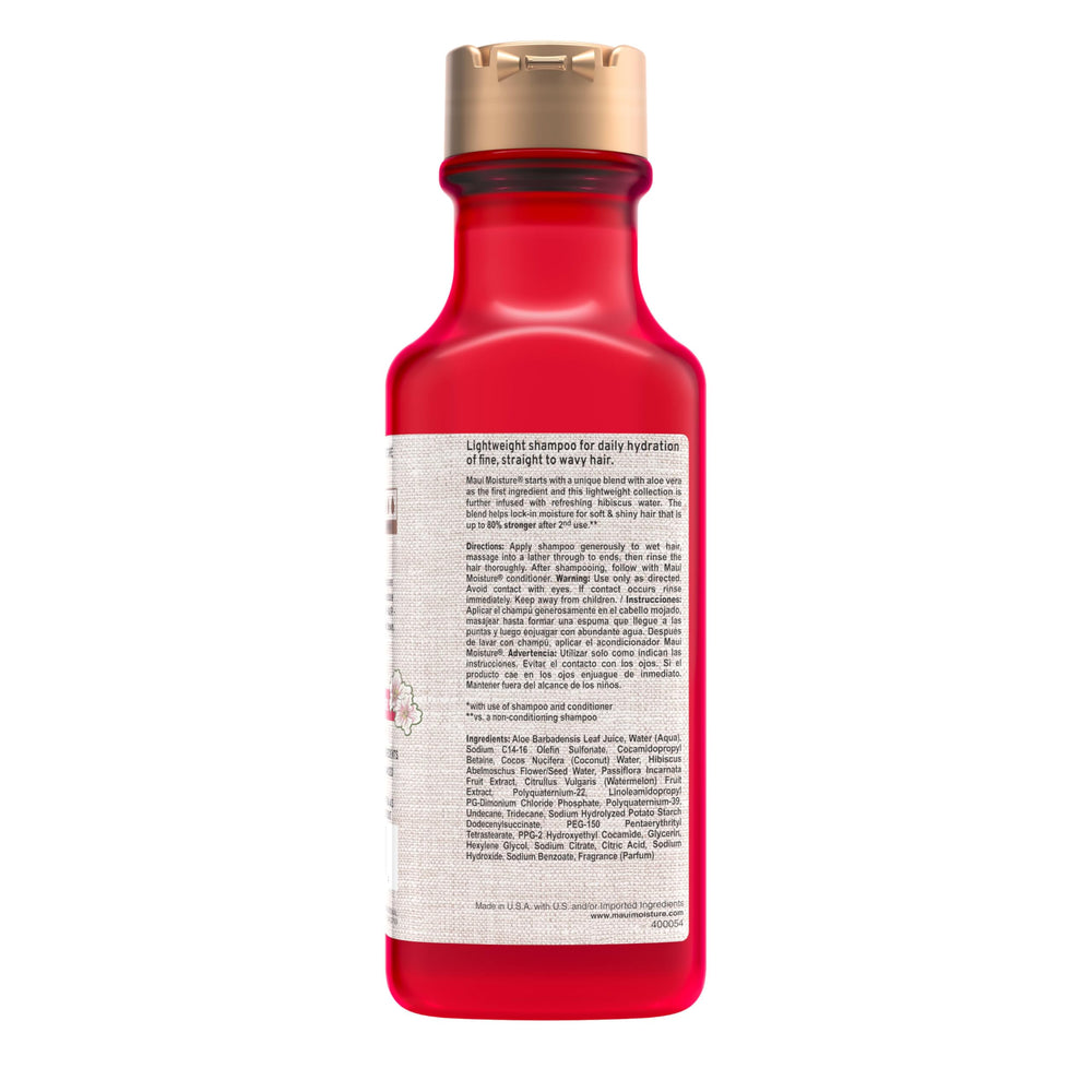 Maui Moisture bottle in tropical setting evoking fresh fruity scent