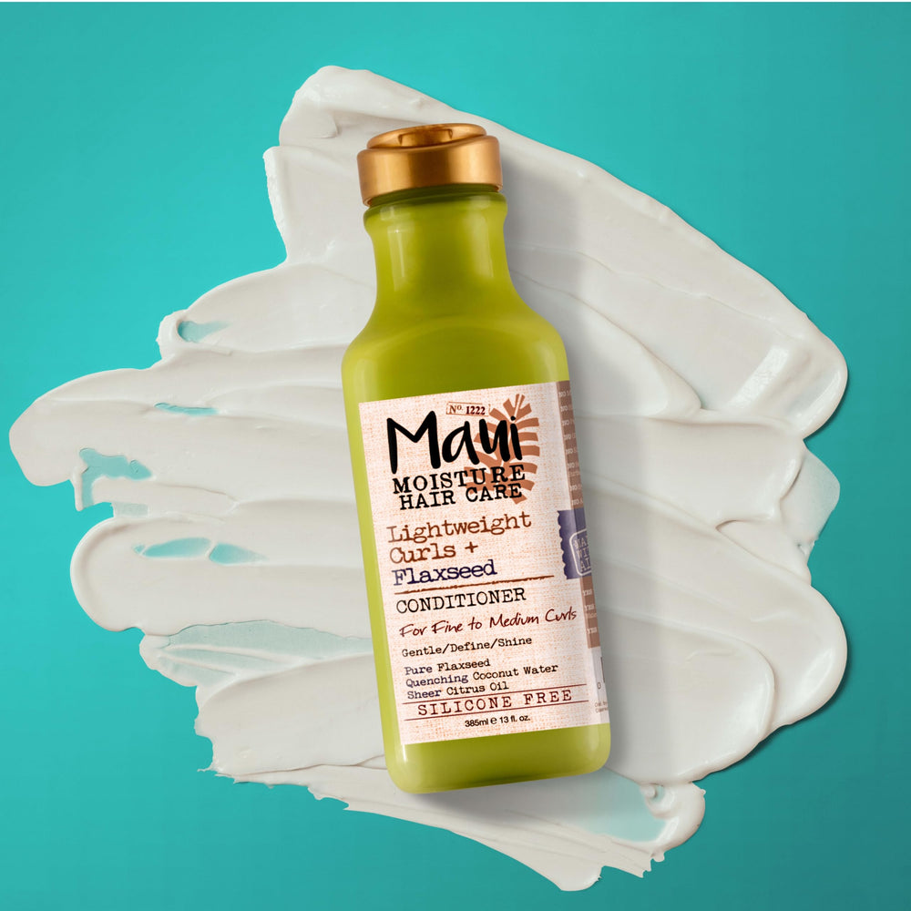 Side-by-side before and after curls with Maui Moisture showing improved definition and shine