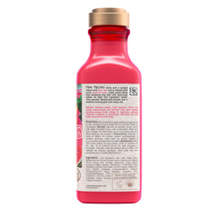 13 fl oz Maui Moisture bottle next to hand to show size and travel-friendly benefit