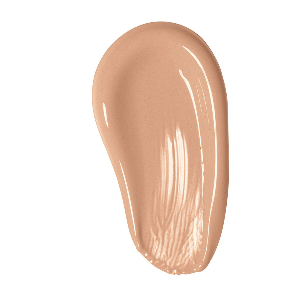 Max Factor blending demonstration with brush showing seamless application advantage