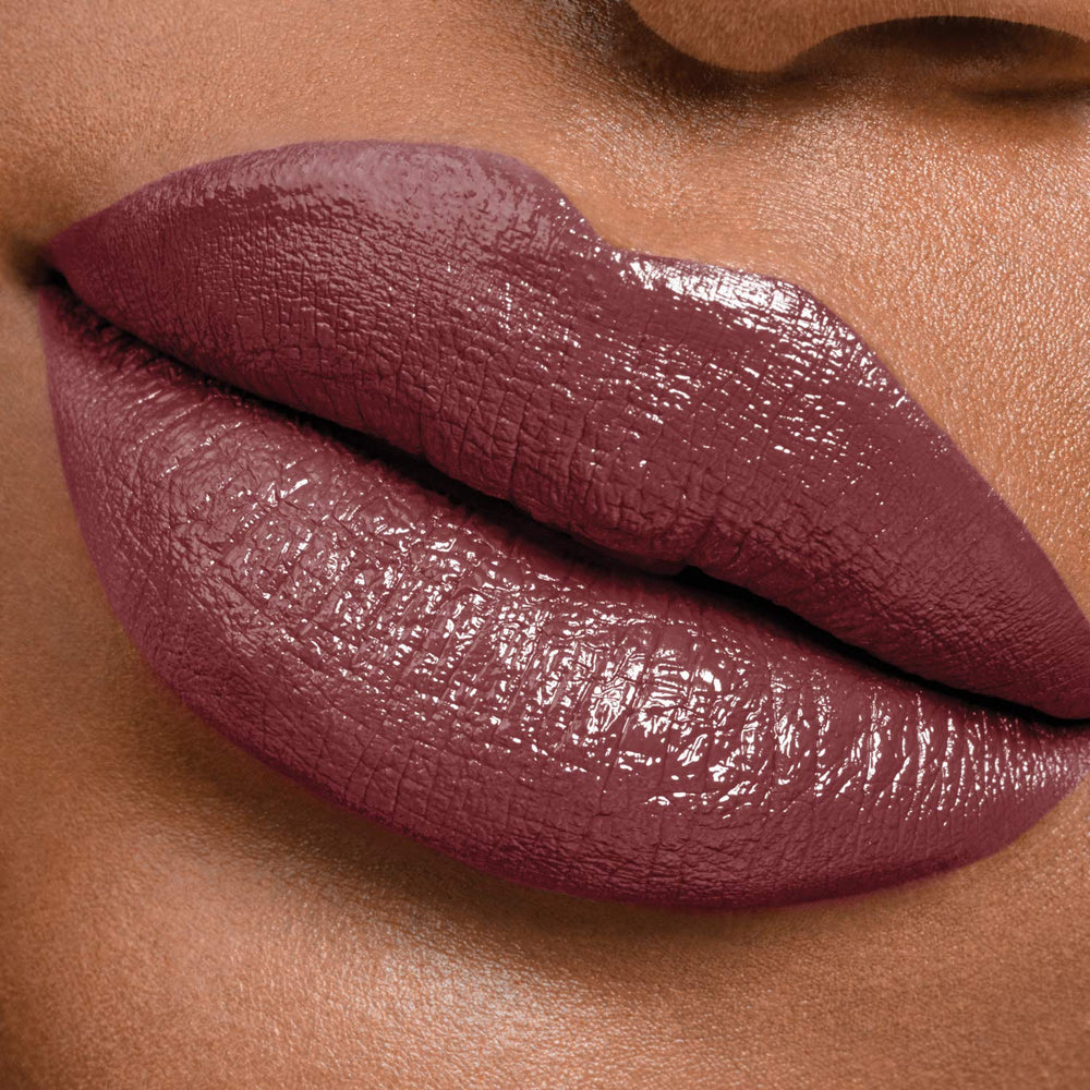Maybelline lip worn at evening event showing long-lasting color and statement look benefit