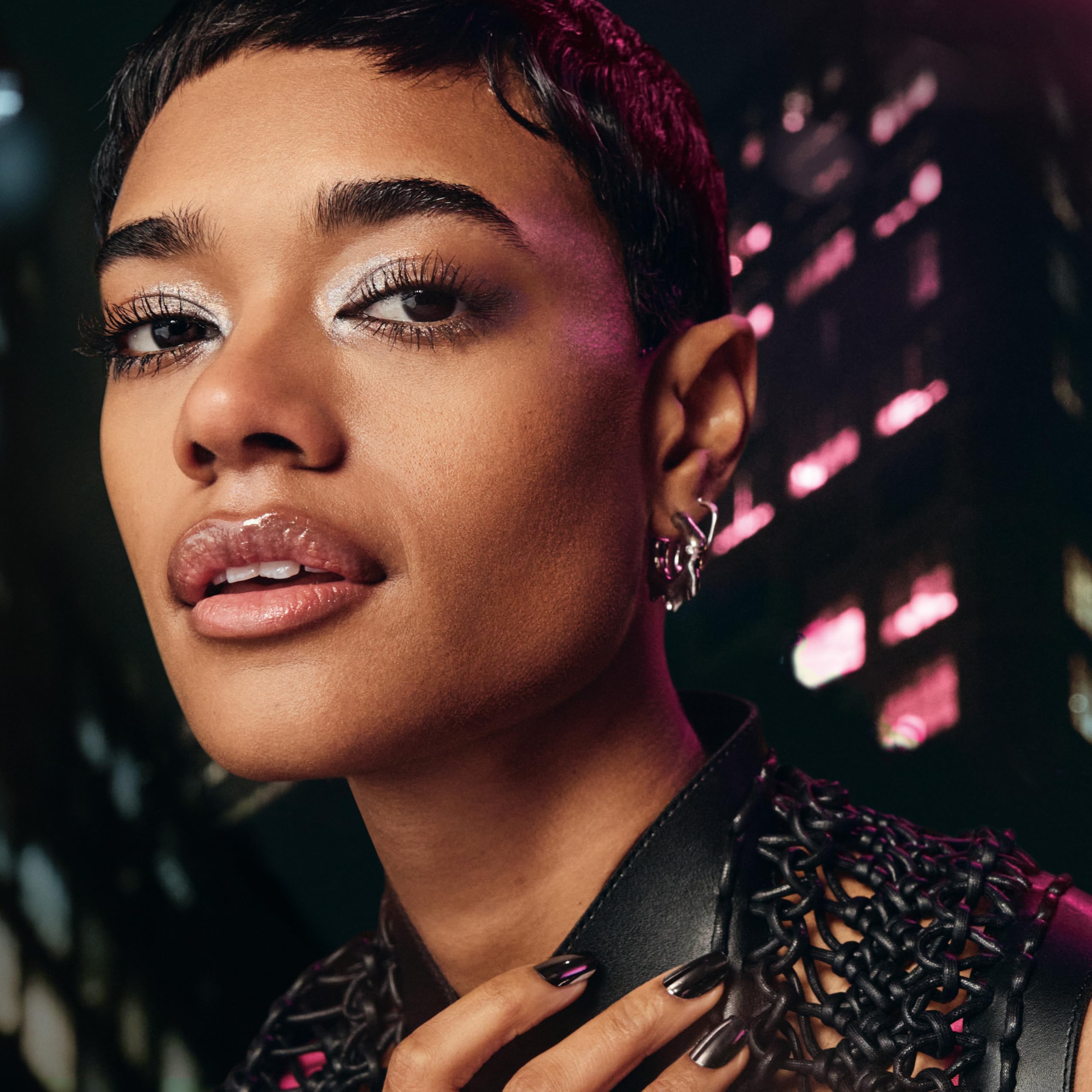 Maybelline Firework swatch on skin showing extra-black pigment and glossy finish