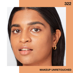 Maybelline Fit Me applied by woman in mirror showing luminous finish and natural glow