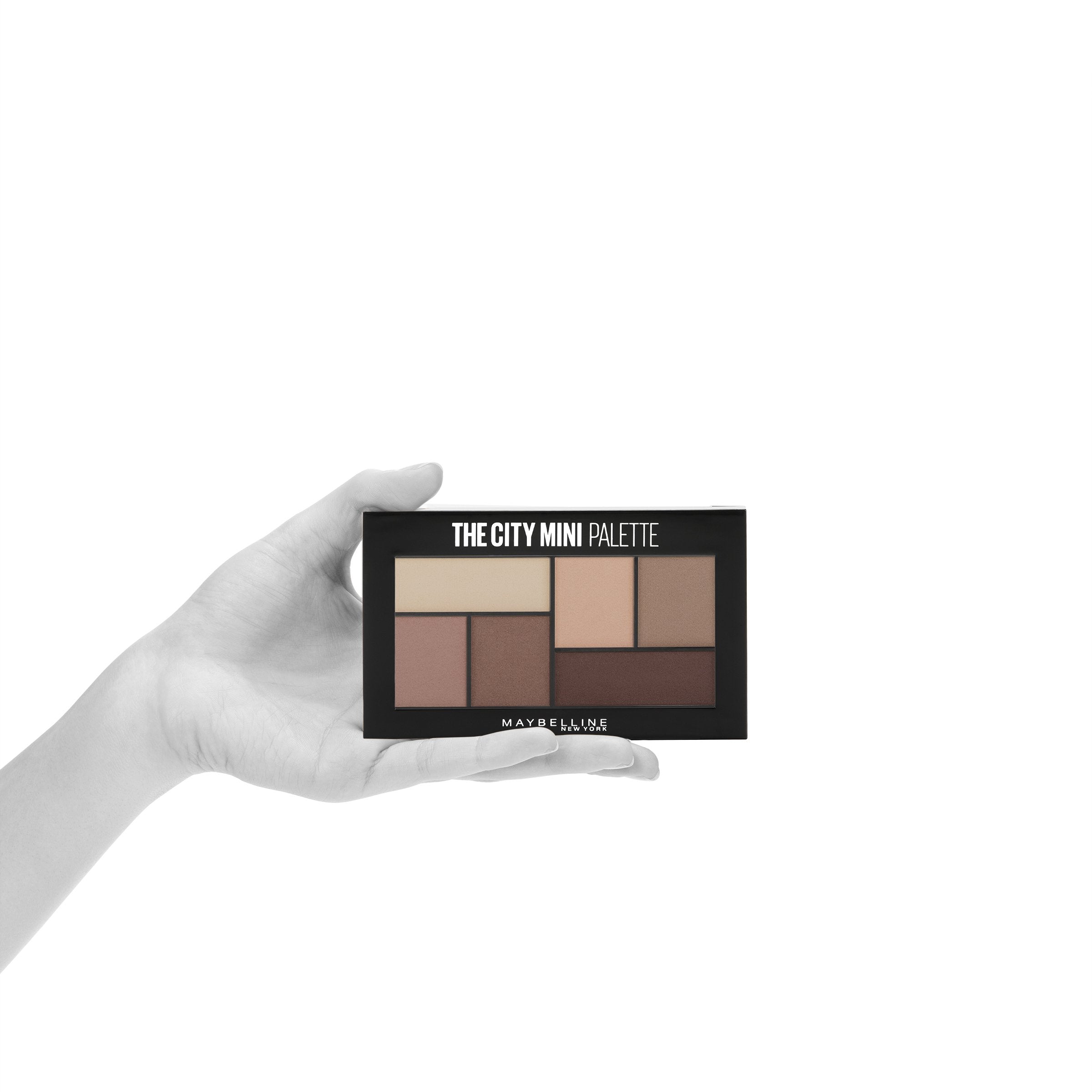 Maybelline lifestyle on city street showing portable palette for on-the-go glam