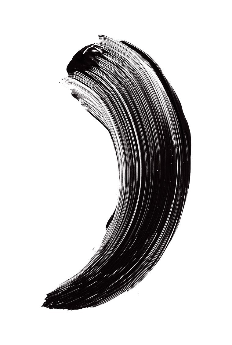 Maybelline Pumped Up Colossal applied on lashes in lifestyle shot delivering visible lifted volume